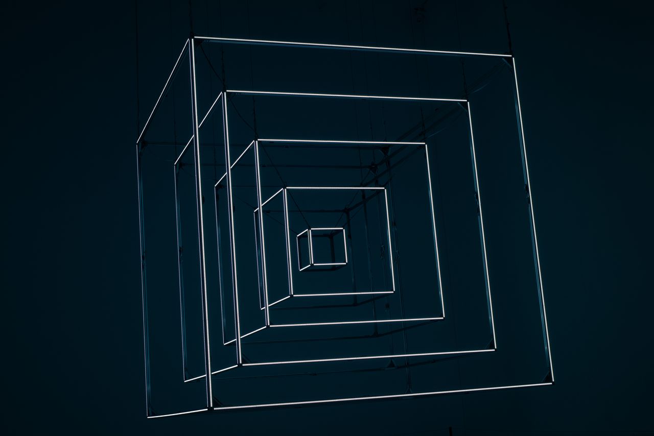 Mastering the First Impression: Your intriguing post title goes here Dynamic abstract design with glowing neon cubes creating depth and perspective.